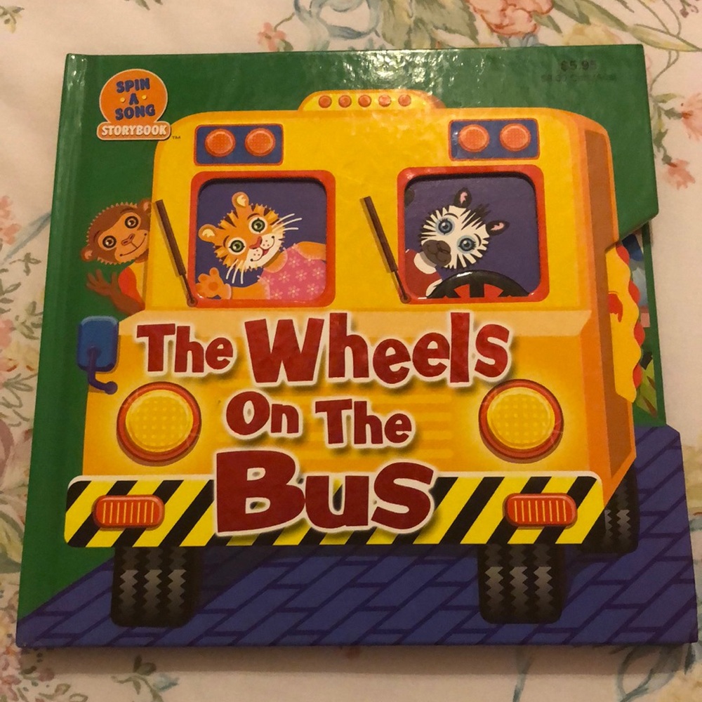 The wheels on the bus spin a song book
